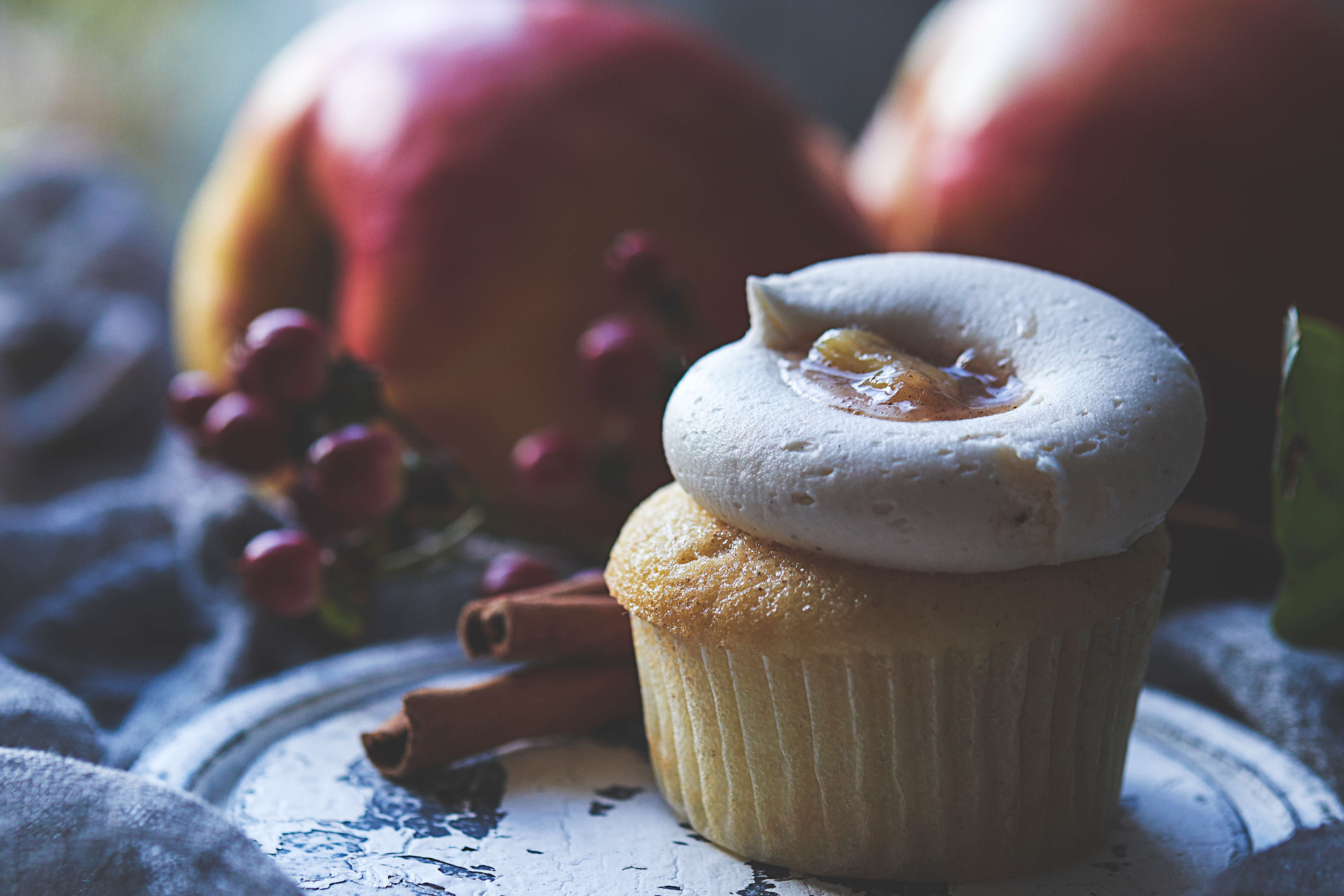 Apple and Cinnamon cupcakes decorated with apples and cinnamon sticks
